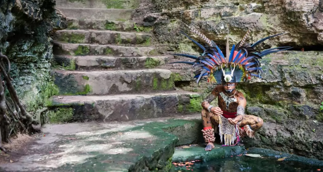 a-mayan-native-on-the-edge-of-a-cenote_t20_ZzbQ6j